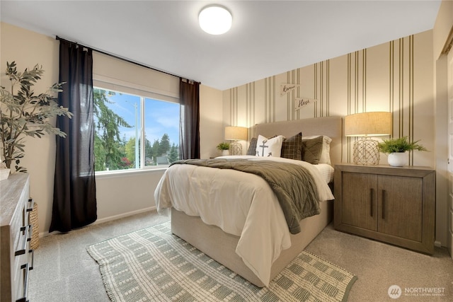 bedroom featuring light carpet, baseboards, and wallpapered walls