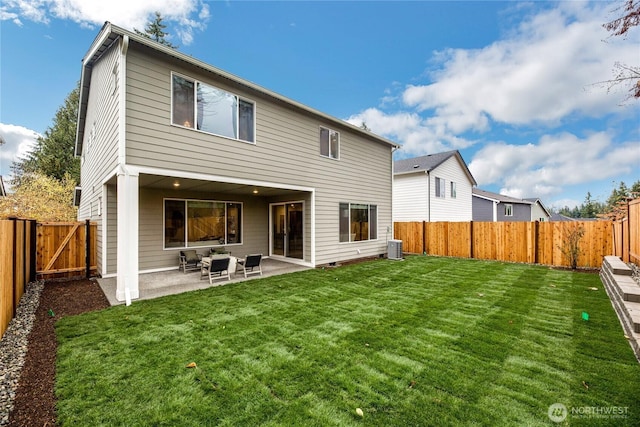 rear view of house featuring a fenced backyard, a patio, central AC, and a lawn