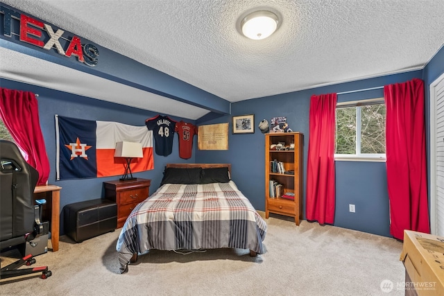 bedroom with carpet flooring, vaulted ceiling with beams, and a textured ceiling