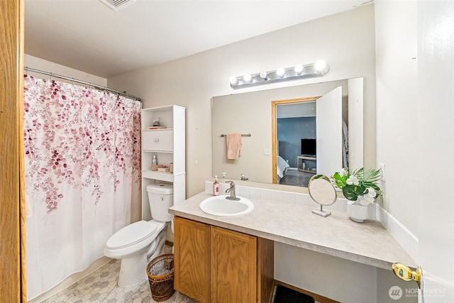 bathroom featuring a shower with shower curtain, visible vents, toilet, and vanity