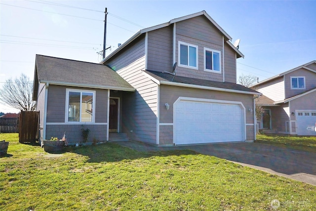 traditional-style home with aphalt driveway, a shingled roof, an attached garage, a front yard, and fence