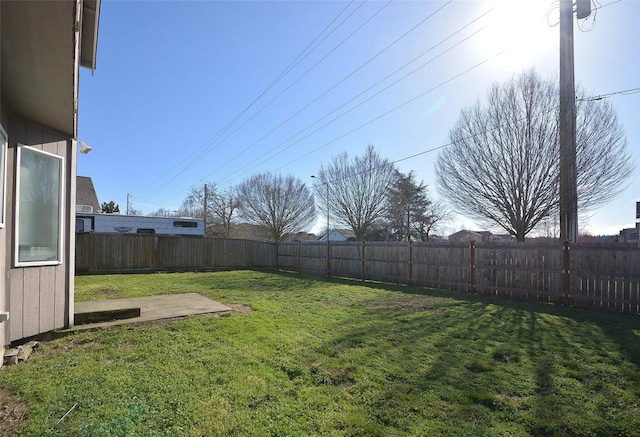 view of yard with a fenced backyard