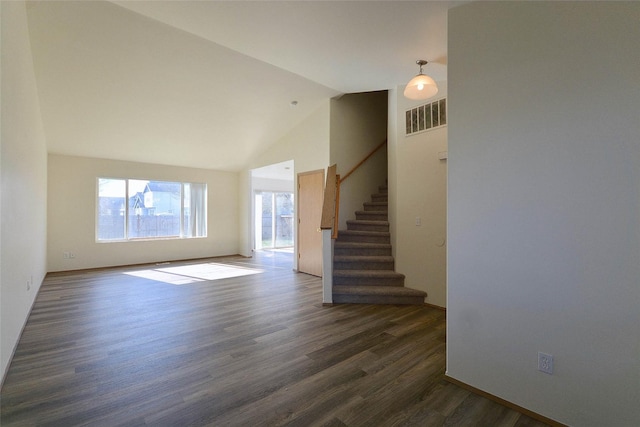 unfurnished living room featuring high vaulted ceiling, visible vents, dark wood finished floors, and stairway