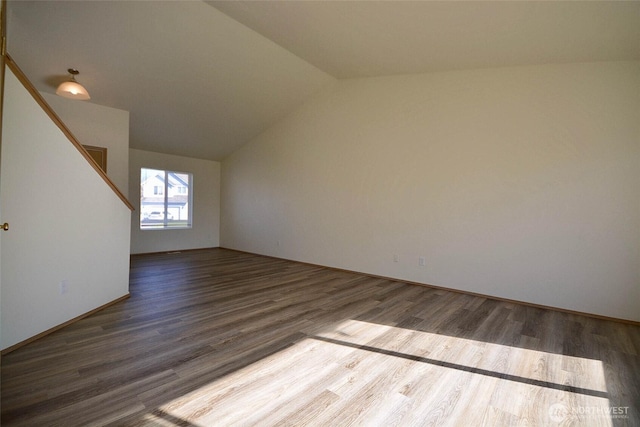 interior space featuring vaulted ceiling and wood finished floors