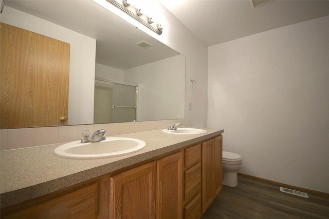 bathroom featuring a sink, visible vents, and a shower stall