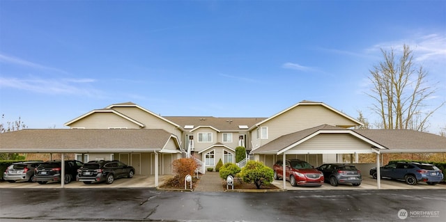 view of front of property featuring covered parking