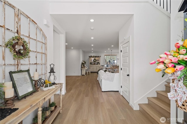 entryway featuring light wood-style floors, recessed lighting, stairway, and baseboards