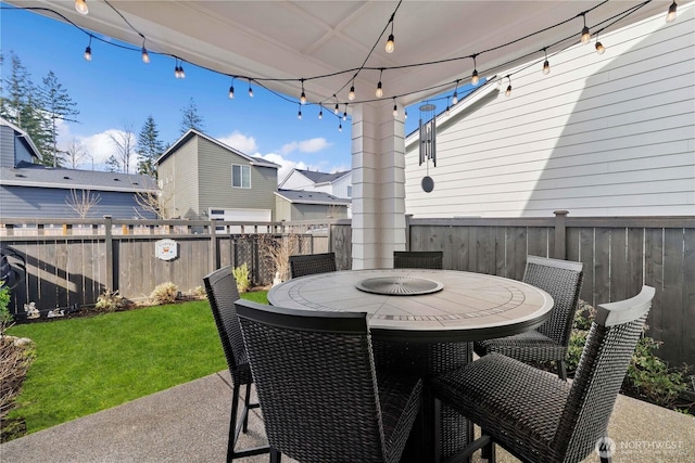 view of patio featuring fence and outdoor dining space