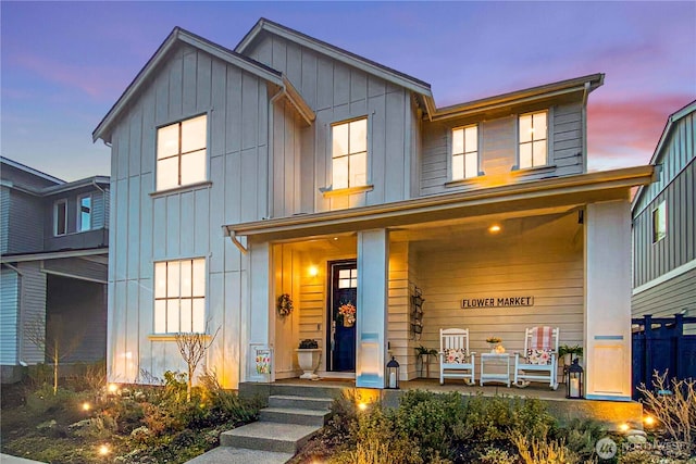 view of front of property with board and batten siding and covered porch