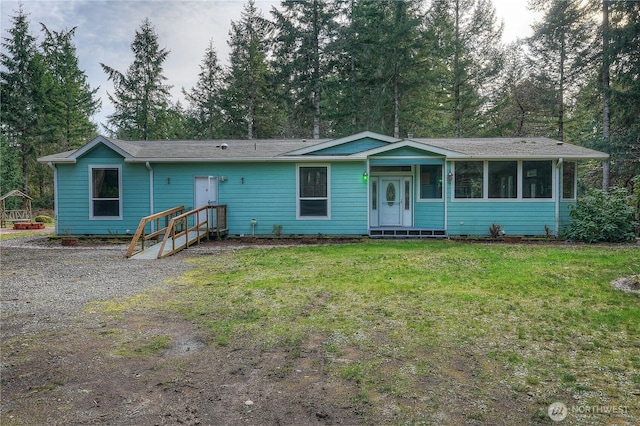 single story home featuring a front yard