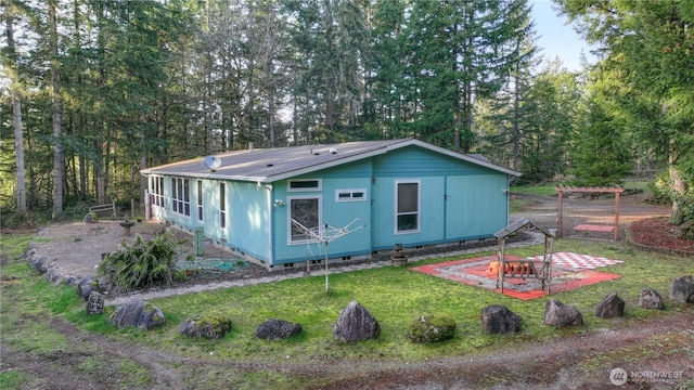 exterior space featuring a front yard and crawl space