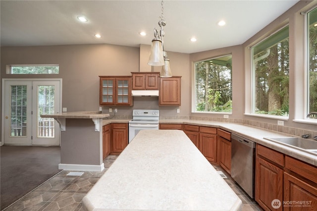 kitchen with a peninsula, electric range, light countertops, under cabinet range hood, and dishwasher