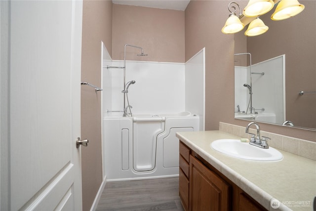 full bath featuring wood finished floors and vanity