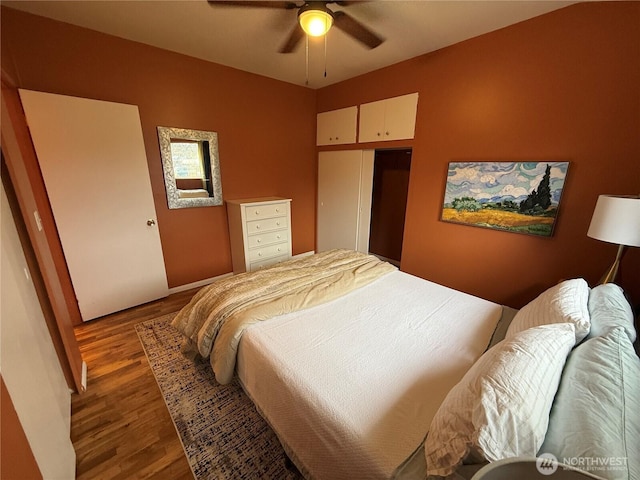 bedroom featuring ceiling fan and wood finished floors