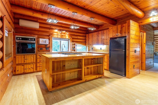 kitchen featuring light wood-style floors, black appliances, open shelves, a sink, and a wall mounted AC