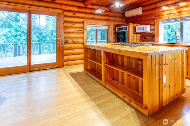 kitchen featuring white microwave, a wall mounted air conditioner, oven, open shelves, and wooden counters