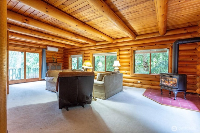 carpeted living room featuring a wood stove, a healthy amount of sunlight, and beamed ceiling