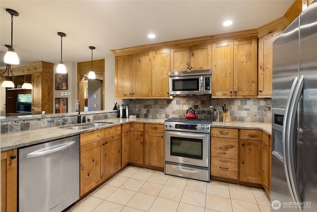 kitchen featuring appliances with stainless steel finishes, a sink, backsplash, and light tile patterned floors