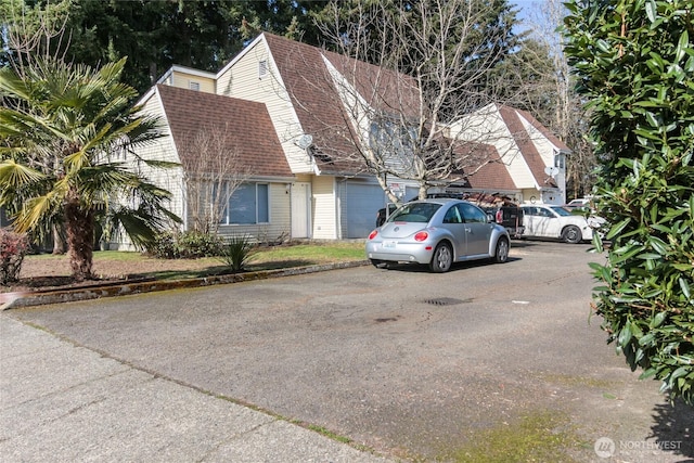 view of front of property with a shingled roof