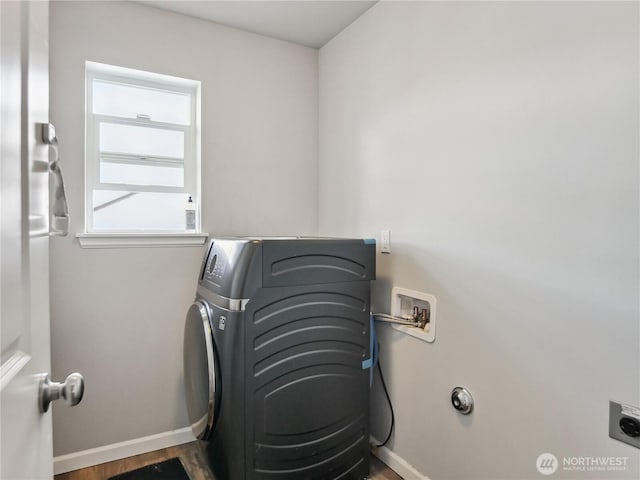 laundry area with laundry area, hookup for a washing machine, baseboards, and electric dryer hookup