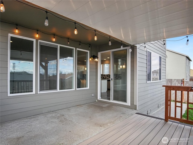 wooden terrace featuring a patio