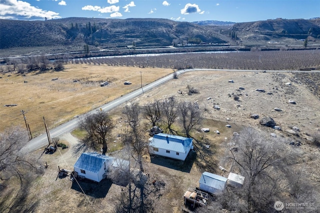 birds eye view of property featuring a rural view and a mountain view