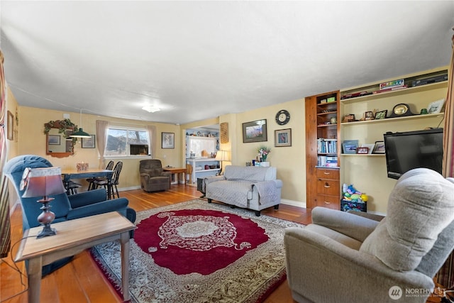 living room with wood finished floors and baseboards