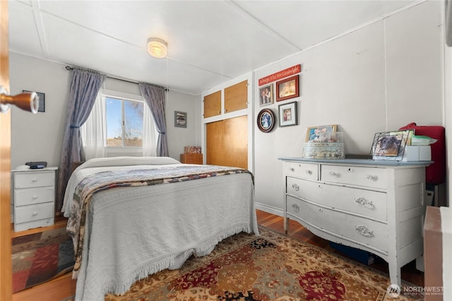 bedroom with wood finished floors