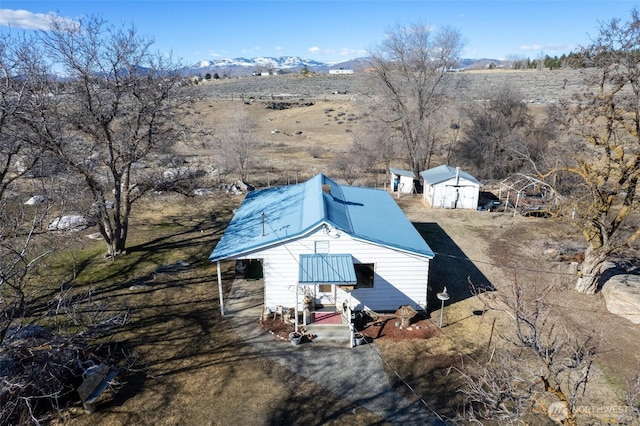 birds eye view of property with a mountain view