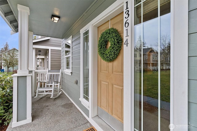 property entrance featuring covered porch