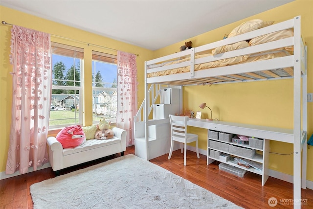 bedroom featuring wood finished floors