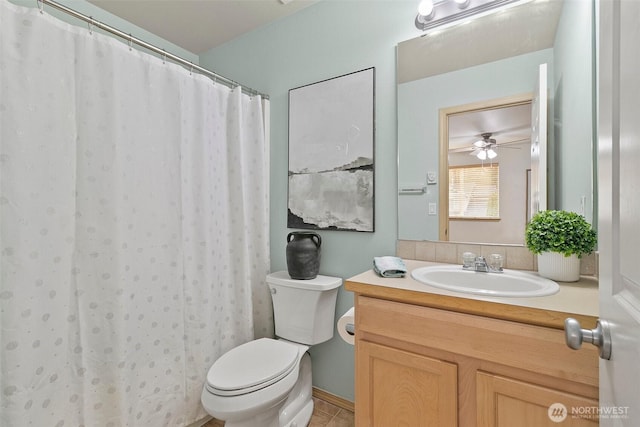 bathroom featuring toilet, tile patterned flooring, a shower with shower curtain, and vanity