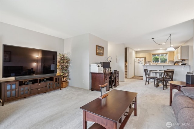 living room featuring light carpet