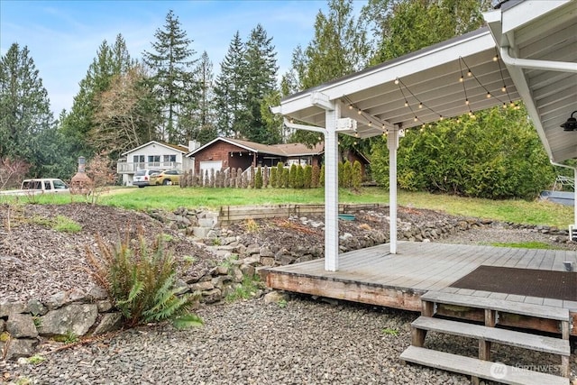 view of yard featuring a wooden deck