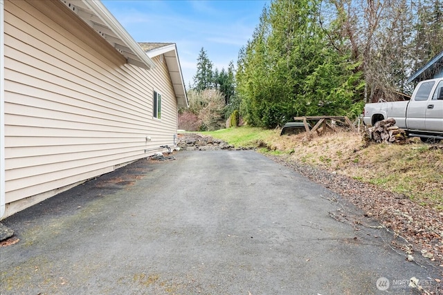 view of side of home with a patio