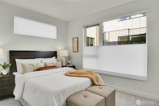 carpeted bedroom with baseboards