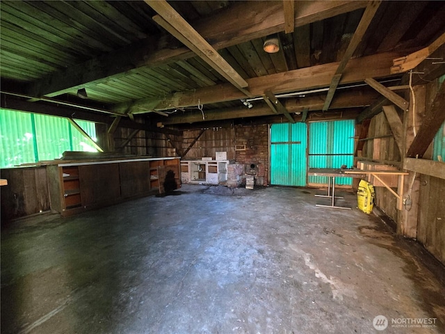 miscellaneous room featuring unfinished concrete flooring