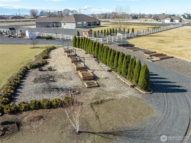 birds eye view of property featuring a rural view