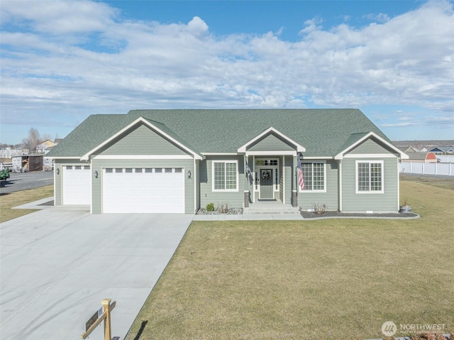 ranch-style house featuring concrete driveway, roof with shingles, an attached garage, and a front lawn