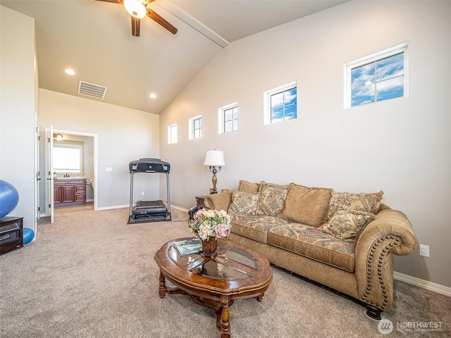 carpeted living room featuring a wealth of natural light, recessed lighting, visible vents, and baseboards