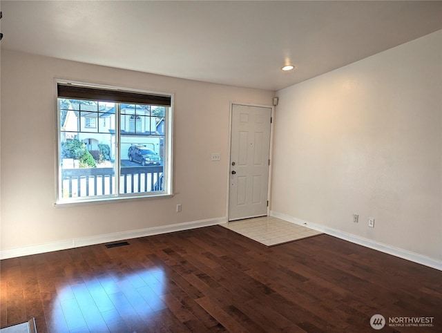 entrance foyer with recessed lighting, wood finished floors, visible vents, and baseboards