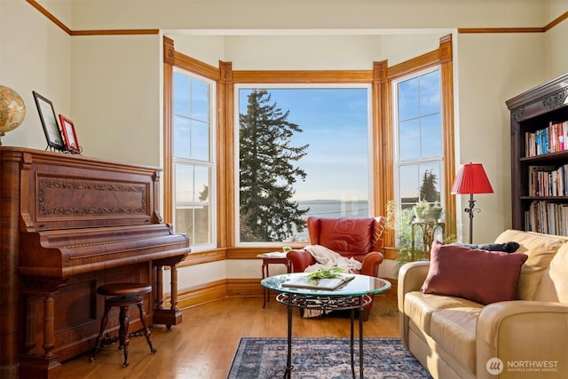 sitting room with wood finished floors and baseboards