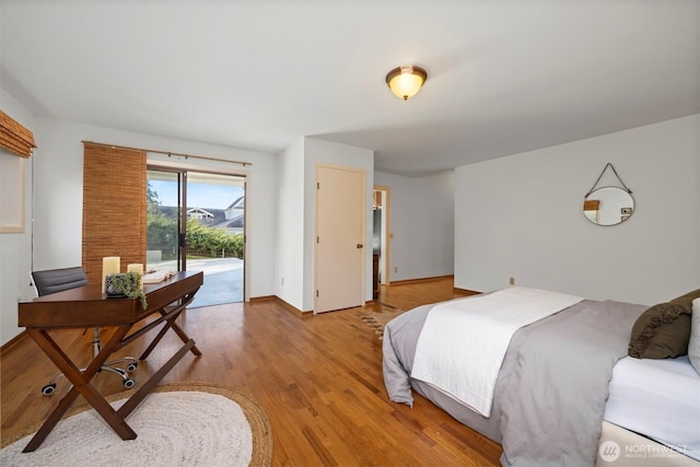 bedroom featuring light wood-style floors, access to outside, and baseboards