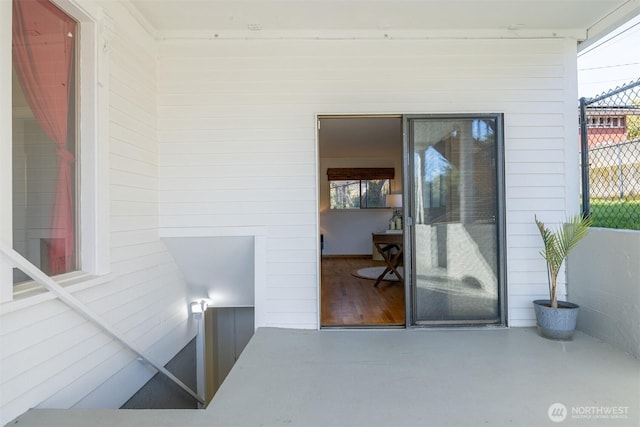 doorway to property with fence