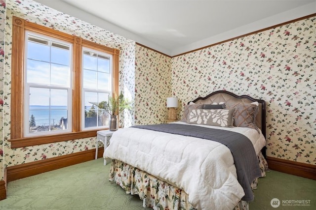 bedroom with wallpapered walls, baseboards, and carpet flooring