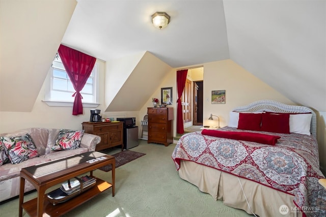 carpeted bedroom with lofted ceiling