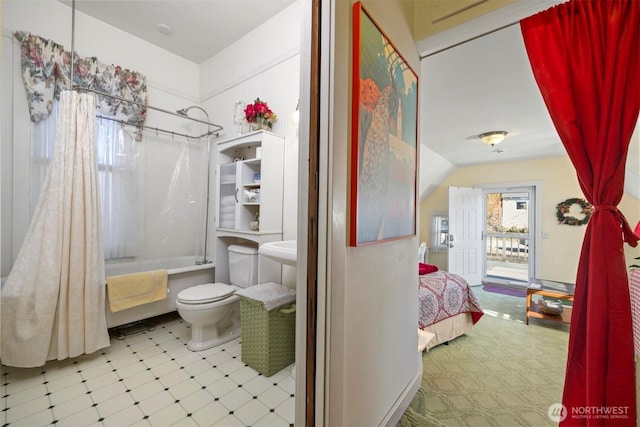 ensuite bathroom featuring connected bathroom, toilet, tile patterned floors, vaulted ceiling, and shower / tub combo with curtain