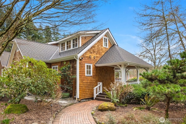 view of front of property with a shingled roof