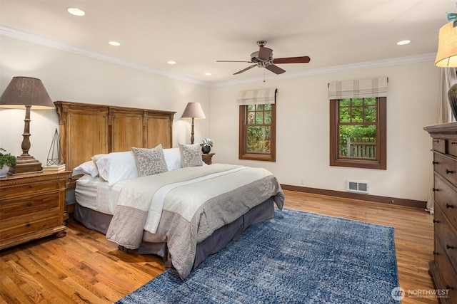 bedroom with crown molding, recessed lighting, visible vents, light wood-style flooring, and baseboards