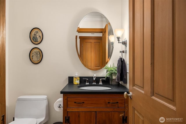 bathroom with vanity and toilet